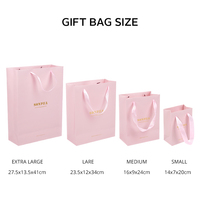 Sac à provisions en papier imprimé rose de boutique avec poignées en ruban emballage de vêtements sacs en papier avec logo personnalisé