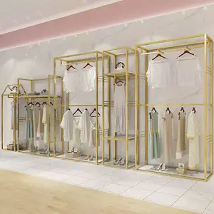 Gold Clothing Rack Apparel Retail Nesting Table Clothes Shelving Metal Garment Display Rack Clothing Store Furniture