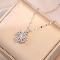 Ensemble de bijoux minimaliste rotatif à quatre feuilles de trèfle, collier, boucles d'oreilles, bracelet, bague, incrusté de zircon, en acier inoxydable