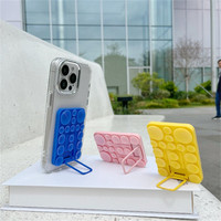 Support de téléphone de bureau pliable noir en silicone souple, support universel à ventouse avec adhésif arrière pour coque de téléphone