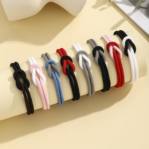 <span class=keywords><strong>Bracelet</strong></span> bicolore européen et américain noir et blanc à 8 noeuds en corde de Milan tissé réglable cadeau de Saint Valentin pour hommes et femmes - Product Image 1