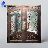 Porte d'entrée classique en fer forgé avec design artisanal, verre trempé et sécurité renforcée pour la maison