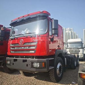 Camion tracteur Shacman 6X4 10 roues 30t de haute qualité à 12 vitesses, à passage de vitesses fluide, diesel robuste avec direction à gauche pour le <span class=keywords><strong>transport</strong></span> <span class=keywords><strong>routier</strong></span> - Product Image 1
