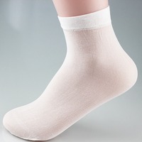 Chaussettes jetables non tissées avec poignée antidérapante Chaussettes à usage unique pour services de location 50 paires/sac Chaussettes couvre-pieds