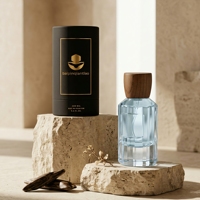 Venta al por Mayor de Botellas de Perfume de Vidrio Transparente de Alta Calidad de 50 ml y 100 ml con Tapas de Madera y Caja Redonda