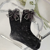 Chaussettes longues en dentelle résille pour filles de luxe avec grand nœud noir et blanc longueur d'équipage respirant et élégant pour la saison d'automne