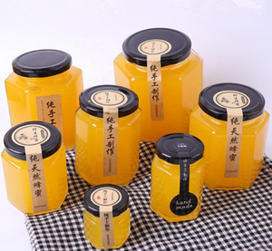 ขวดแก้วทรงรีหกเหลี่ยมทุกชนิด ขนาด 500 กรัม 380 มล. ขวดแก้วใส่น้ำผึ้ง ฝาโลหะสีดำ เงิน ทอง แบบกำหนดเอง ขวดแก้วหรูหราสำหรับใส่น้ำผึ้งและแยม - Product Image 1