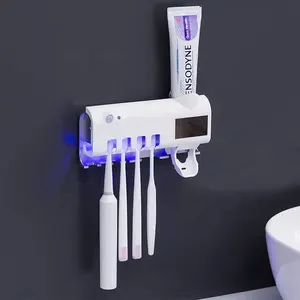 热销多功能电动自动牙膏分配器紫外线牙刷架浴室收纳器墙
