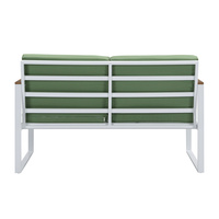 Chaise de jardin moderne en rotin vert avec coussin et pieds en métal blanc pour cour