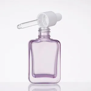 Luxus-Rechteck-Glas-Tropfflasche für Serum lila rechteckige Lotionsflasche für Großhandel