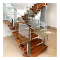 Escalier intérieur moderne en colimaçon pour Hall Garde-corps en acier inoxydable durable Bande de roulement en bois Mono Stringer pour appartements hôtels villas