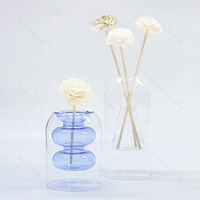 Bouteilles vides de diffuseur de roseau de parfum de Borosilicate en verre de conception Unique de Double couche transparente pour l'huile essentielle