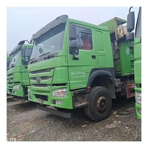 SINOTRUK HOWO butik digunakan 6*4 truk sampah Dump Truck grosir lemparan tangan kiri