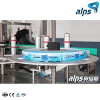 Machine de dépose de papier automatique, avec bouteilles ou boîtes de fer blanc, thermofusible