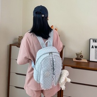 Sac à dos décontracté pour femme, style mignon et doux, avec breloque poupée en peluche, grande capacité de rangement, idéal pour les voyages quotidiens