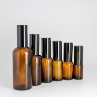 Emballage cosmétique bon marché noir mat or argent couvercles parfum rechargeable chambre vaporisateur bouteille en verre 100ml