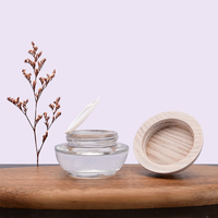 50g Color claro Claro Vidrio transparente Frasco cosmético Ceniza Tapa de madera Tapa de plástico Capacidad para el embalaje del cuidado de la piel