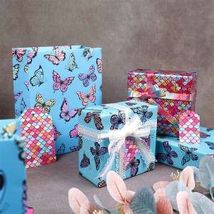 Papier laser de Noël de haute qualité jetable enduit 80g 43*300cm Papier cadeau de luxe personnalisé pour anniversaire Rouleau de papier d'emballage - Product Image 4