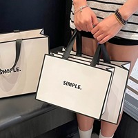 Sac fourre-tout en papier personnalisé avec poignée en ruban, finition mate, impression de logo, commande en gros