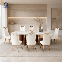 Table à manger ovale en marbre de luxe silencieuse avec base en noyer et acier inoxydable or rose, mobilier pour projets de villas, vente en gros directe d'usine