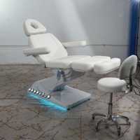 Table de massage électrique au design classique moderne, lit de beauté pour salon, lit facial pour traitement des cils, lit d'esthéticienne, base blanche