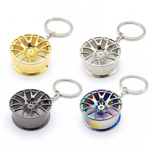 Llavero de coche con llanta de rueda de varios estilos al por mayor, llavero de metal duradero con forma de neumático para regalos de tiendas 4S - Product Image 1