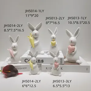 Dekorasi rumah patung ornamen kelinci lucu memegang telur patung keramik kelinci dekorasi Desktop