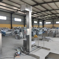 Élévateur de bacs de benne basculante de palan de seau de matériel hydraulique de l'acier inoxydable 200L dans l'ascenseur d'ascenseur de viande de machine de ligne de traitement