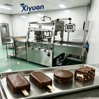 Grande machine à enrober les glaces congelées au chocolat, pour la fabrication de mélange de morceaux de noix, destinée aux usines de transformation d'aliments et de boissons froides