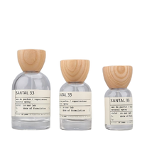 Flacon pulvérisateur de parfum rond en verre transparent rechargeable avec bouchon en bois 30ml/50ml/100ml pour emballage cosmétique et parfum, OEM/ODM disponible