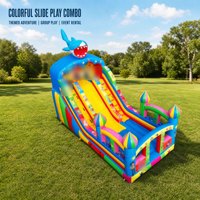 Château gonflable coloré sur le thème du Père Noël avec toboggan, équipement de terrain de jeu extérieur commercial pour les événements d'enfants
