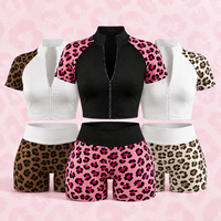 Ensemble de yoga color block imprimé léopard respirant sans couture avec haut court zippé à manches courtes et short push-up personnalisé pour femme