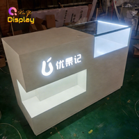 Kiosque de réception commercial moderne en MDF robuste avec LED, recyclable, taille et couleur personnalisables, vente en gros d'usine pour magasins de détail