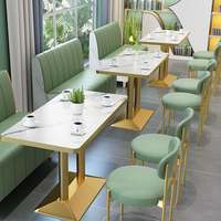 Ensemble de sièges de restaurant modernes en cuir, bois et métal, table à manger à motif marbré, chaises pour usage commercial