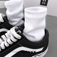 Chaussettes hautes unisexes pour adultes, en coton tricoté doux, couleur unie noir et blanc, avec logo discret, idéales pour le sport en automne, vente en gros