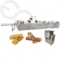 Machine automatique d'extrudeuse de barre de snacks de sésame ligne de production de céréales cassantes machines de fabrication de barres de bonbons protéinées et noix
