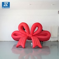 Modèle gonflable géant personnalisé en forme de nœud rouge suspendu pour les festivals, les fêtes, les vitrines de magasins, la publicité en extérieur, décoration gonflable