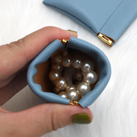 Sac tendance en cuir Pu avec logo design personnalisé haut de gamme pour écouteurs bijoux bague collier sac à poussière en cuir pièce de monnaie avec feuille de fer