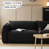 Ensemble de canapés sectionnels modernes avec rembourrage en éponge, tissu en fausse fourrure de mouton noir, design luxueux léger pour petit salon
