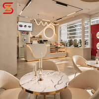 Comptoir de bar à café avec vitrine intégrée pour pâtisseries, unité de rangement et d'exposition pour la vente au détail, idéal pour les cafés ou les boulangeries