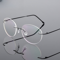 Nouvelle tendance rétro rond en alliage de titane Super élastique sans cadre unisexe montures de lunettes en métal pour la myopie