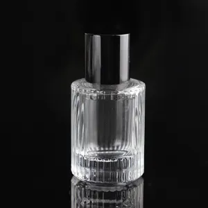 Bouteille de parfum en verre à sertir de haute qualité bouteilles de parfum en verre de cristal rondes de luxe à grain vertical avec charme
