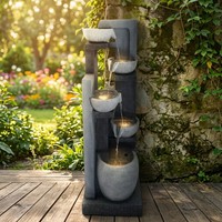 Fontaine d'eau extérieure contemporaine avec des bols à niveaux décalés et une colonne en faux pierre, idéale pour le jardin ou la terrasse