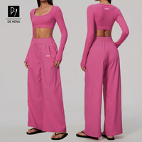 Nouvel ensemble de fitness au design moderne : haut de sport court à manches longues et coupe ajustée, et pantalon taille haute ample pour le yoga, pour femmes