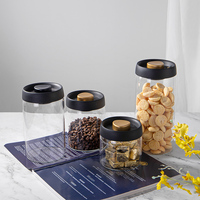 JINGHUANG OEM/ODM Articles de cuisine Logo personnalisé Pot de stockage de grains de café en verre borosilicate transparent scellé sous vide avec couvercle noir
