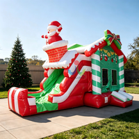 Structure gonflable de Noël avec toboggan et toit Père Noël pour enfants, idéale pour les fêtes et événements en extérieur