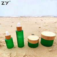 Vente en gros de flacons compte-gouttes plats en bambou inhabituels de 30ml 70ml 50ml 2oz pour crème pour le visage à l'huile capillaire avec manipulation de surface sérigraphique