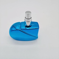 Vaporisateur de parfum en verre vide coloré en forme de coeur portable 25ml avec placage UV pour femmes