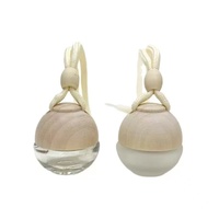 Diffuseurs de parfum pour voiture en forme de boule de 6 ml avec cordelette de suspension, couvercle à vis en bois et surface sérigraphiée