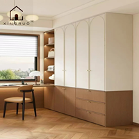 Armoire autoportante moderne européenne Xingruo, construction en bois durable, portes blanches style Shaker, poignées métalliques, 3 à 5 tiroirs, arquée